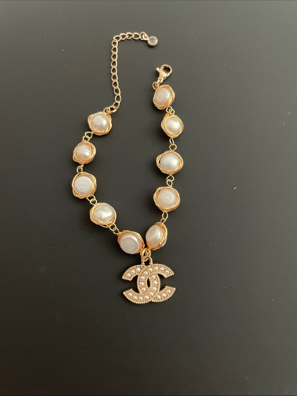 CC logo repurposed into Pearl Charm Bracelet